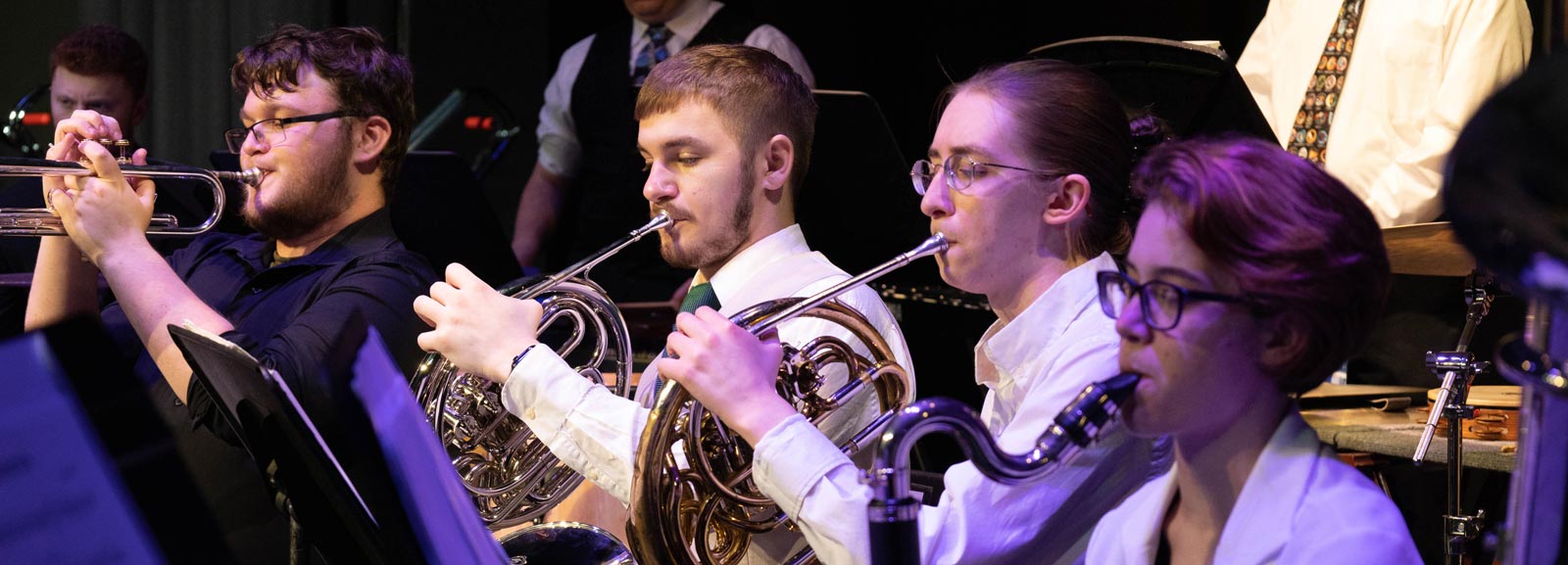 closeup photo of the concert band playing their instruments during a performance