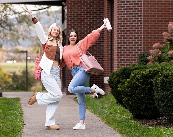 two college students excited about being on campus