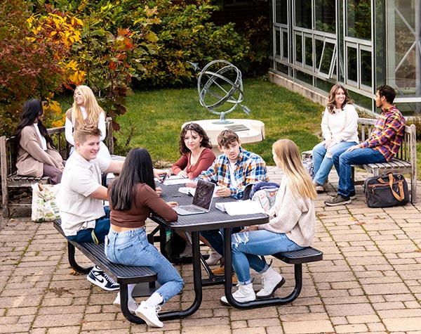 Students gathered around campus engaged in conversation