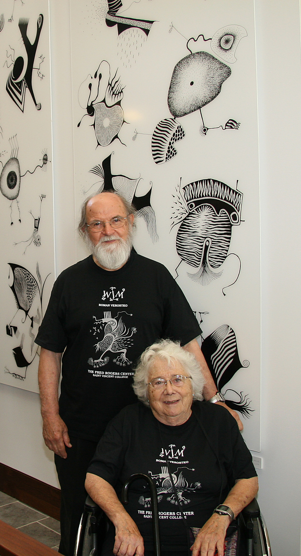 3. Alice Wagstaff and Roman Verostko celebrating the dedication of Verostko’s WIM: The Upsidedown Mural at the Fred Rogers Center, Saint Vincent College. 2006.