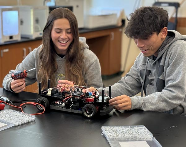 Photo of Saint Vincent College students at work in the engineering lab