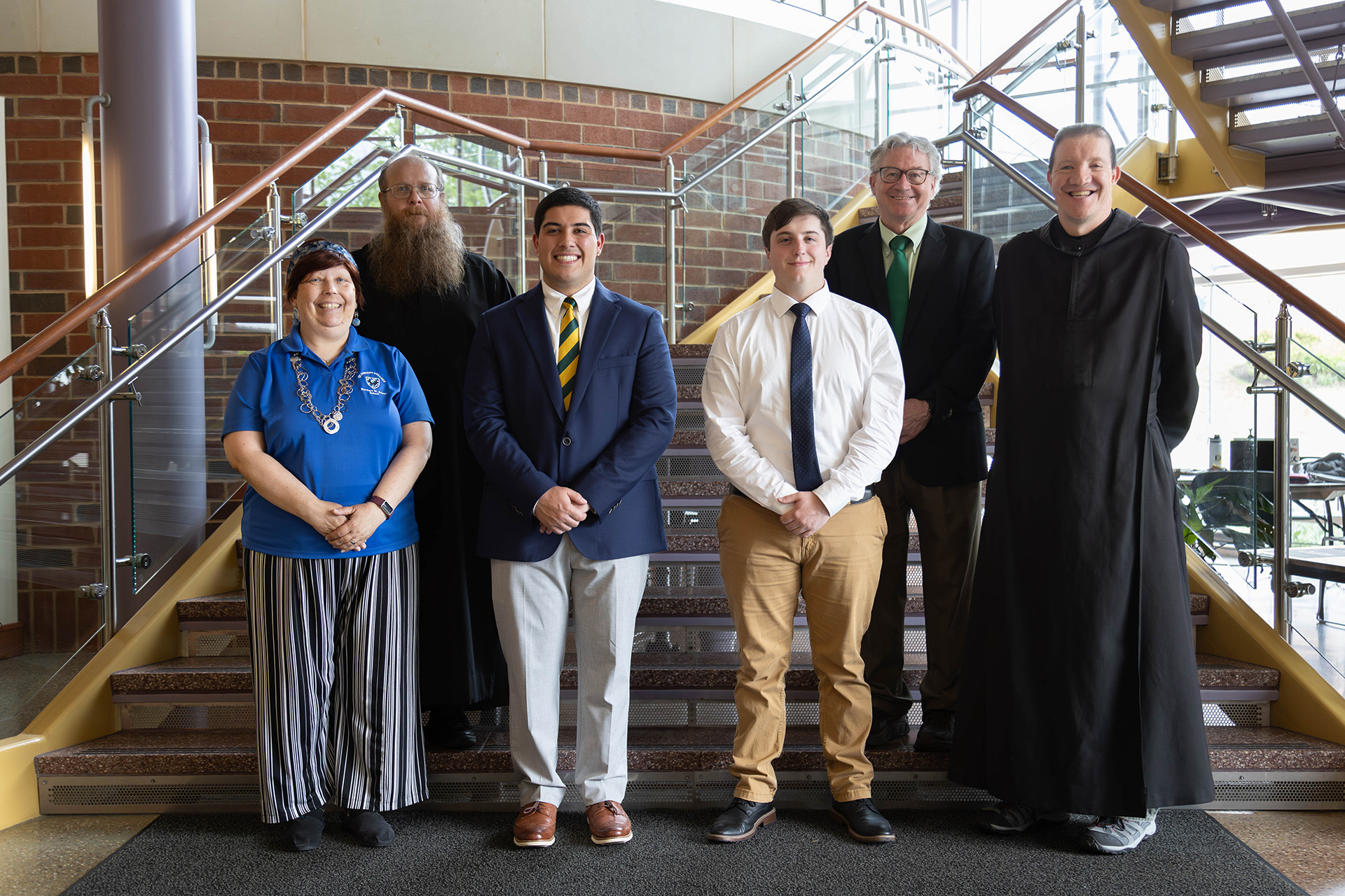 Photo 3 Boyer School graduates and faculty standing together for a photo