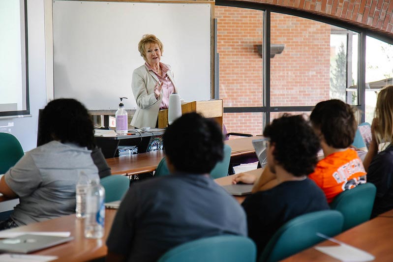 Dr. Helen Burns instructs a class of nursing students.