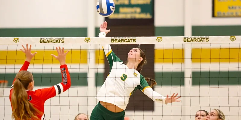 SVC womens volleyball play hits ball over the net