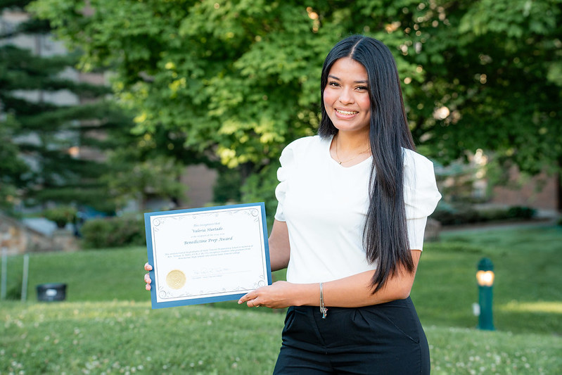 Valeria Hurtado holding the Benedict Prep Award from Saint Vincent College.