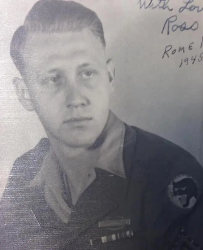 Black and white portrait of a young man in military uniform with medals, taken in 1945.